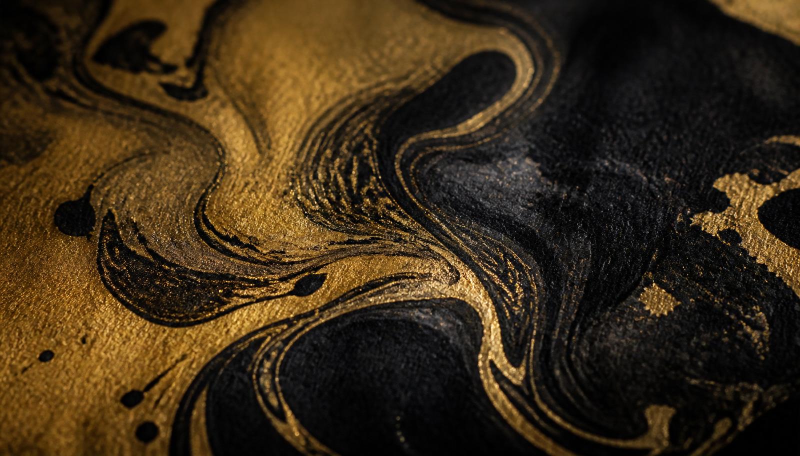 Macro of gold and black ink on textured paper
